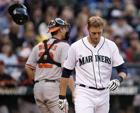 &lt;p&gt;Seattle Mariners' Michael Saunders walks past his bouncing helmet after he slammed it down after striking out as Baltimore Orioles catcher Matt Wieters heads to the dugout in the fifth inning during a baseball game Tuesday, July 3, 2012, in Seattle. (AP Photo/Elaine Thompson)&lt;/p&gt;