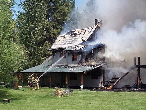 Karen Peterson/Leader<br>James and Debbie Stone, of Pablo, returned home Monday to find their house on fire, after a neighbor called to tell them. They lost everything, but nobody was hurt. They said they will stay at a friend's house until they determine their next step.