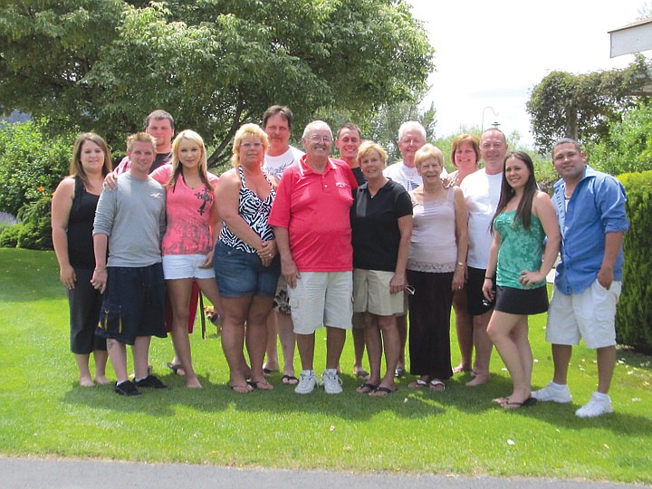 Several family members arrived at least a day early for last Saturday's celebration of the Wes and Carol Prinzen 50th wedding anniversary. Wes (orange) and Carol (black) are in the middle. From left, the rest of the family members are grand-daughter Stacie Pike, grandson-in-law Christopher Barber, grandson-in-law Jeremy Mills, grand-daughter Stephanie Pike, daughter Kristie Pike, son-in-law Sheldon Powelson, grandson Kyle Soto, brother-in-law Robert Knight, Carol's sister Elaine Knight, niece Tracy Dickinson, nephew-in-law Joe Dickinson, grand-daughter Brianna Soto and Brianna's fiance Eddie Martinez.