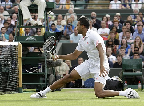 &lt;p&gt;Jo-Wilfried Tsonga of France plays the winning volley to defeat Philipp Kohlschreiber of Germany during a quarterfinals match at the All England Lawn Tennis Championships at Wimbledon, England, Wednesday, July 4, 2012. (AP Photo/Kirsty Wigglesworth)&lt;/p&gt;