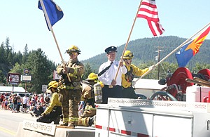 <p>U.S. Highway 2 in Troy was lined with thousands of parade-goers Thursday as the weather cooperated, and the multitudes got to enjoy America’s 237th birthday party. The festive day was not without a note of solemnity as local firefighters commemorated all firefighters who had given their lives in the line of duty. However, this Fourth was especially painful with the death of 19 elite firefighters earlier this week. On this float, firefighters commemorated the fallen, and particularly this year with the Arizona state flag. </p><div><strong> </strong></div>