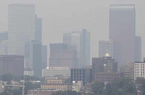 &lt;p&gt;Skyscrapers in downtown Denver are obscured by smoke drifting down from fires in Wyoming, eastern Montana and western South Dakota on Wednesday, July 4, 2012. While the wildfires are contained in Colorado, states to the north are facing an uphill battle as blazes burn unabated within their borders on Independence Day. (AP Photo/David Zalubowski)&lt;/p&gt;