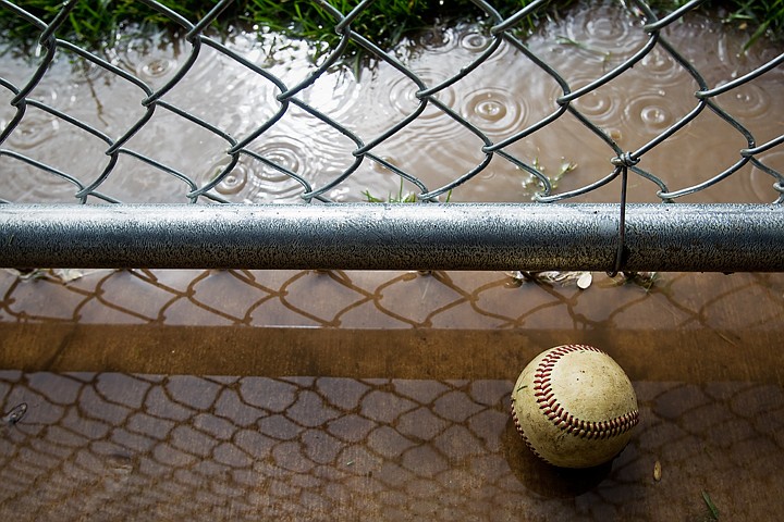 &lt;p&gt;SHAWN GUST/Press Rain floods a dugout after a downpour prompted the canceling of a Little League tournament in Coeur d'Alene on Friday. A record .57 inches of rain had fallen by the afternoon, beating a 1938 record of .35 inches. Coeur d'Alene also saw a high temperature of 59 degrees, making it the coldest July 2 on record since weather patterns began being tracked in 1895.&lt;/p&gt;