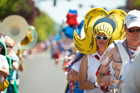 &lt;p&gt;Trena Burt, a member of the Perfection Nots for 10 years, marches along Sherman Avenue Monday while playing tambourine with the band.&lt;/p&gt;