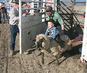 &lt;p&gt;The crowd-pleasing mutton bustin' event kicked off the rodeo on both nights. Here, a cowboy-in-training explodes out of the chute on Saturday.&lt;/p&gt;