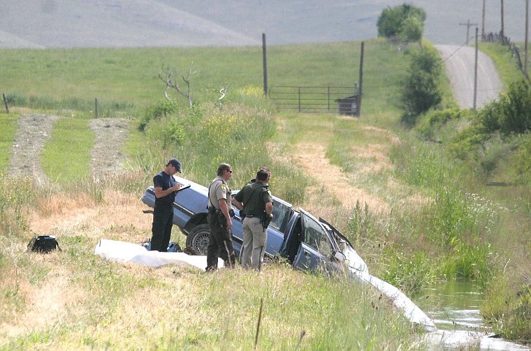 &lt;p&gt;MHP and Sanders County authorities investigate the scene of the single-rollover accident that resulted in one confirmed fatality Thursday in Dixon.&lt;/p&gt;