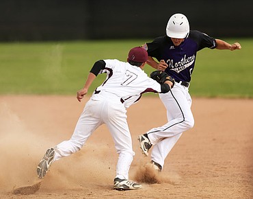 <p>LOREN BENOIT/Press The Prairie Cardinals square-off against the Northern Lakes Mountaineers during an American Legion doubleheader Tuesday evening at Post Falls High School.</p>