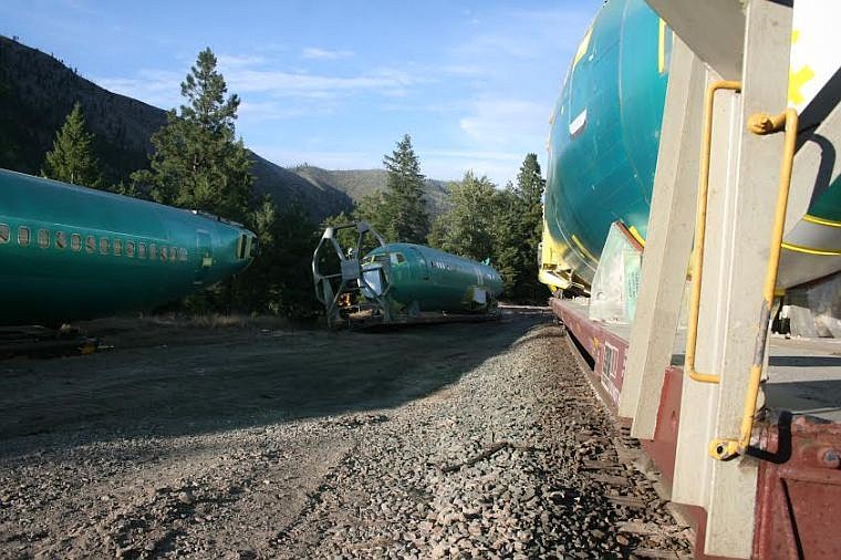 <p>Airplane fuselages wait to be relocated after a train derailed east of Superior. Many of the fuselages were sent into the Clark Fork River, closing the Alberton Gorge section of the river. </p>