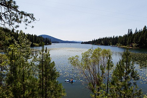 &lt;p&gt;Nick Wright paddles his kayak around Mokins Bay Thursday on Hayden Lake. The Idaho State Department of Agriculture will be contracting a private company for the application of herbicide to treat for Eurasian milfoil in the lake beginning July 16.&lt;/p&gt;