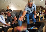 Volunteers pack boxes for troops