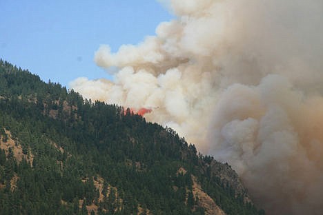 &lt;p&gt;An airplane drops fire retardant on the Cape Horn fire in Bayview Sunday afternoon.&lt;/p&gt;