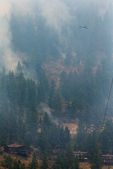 &lt;p&gt;A helicopter makes a pass by the fire that is threatening nearly 300 structures.&lt;/p&gt;