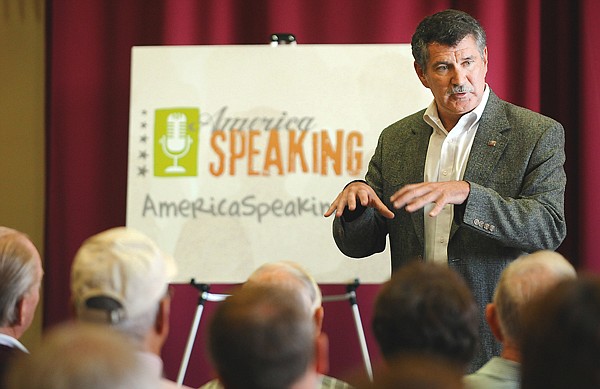 Denny Rehberg responds to a comment from the crowd gathered to voice their opinions and hear responses from the congressman on Tuesday at the America Speaking Out event at FVCC.