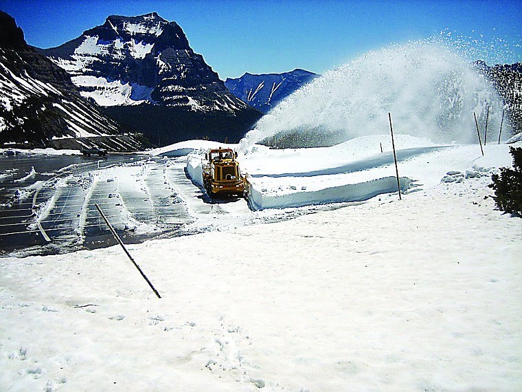 &lt;p&gt;A rotary plow clears snow from the Logan Pass Visitor Center
parking lot on Wednesday.&lt;/p&gt;