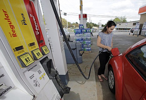 &lt;p&gt;In this April 6 photo, Lucy Perez, of Charlotte, N.C., pumps gas at a station in Matthews, N.C. A slew of global economic and geopolitical factors are working to pummel the price of oil and set up U.S. drivers for very low gasoline prices later this year.&#160;&lt;/p&gt;