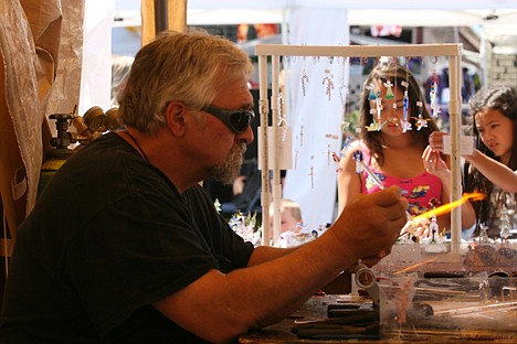 &lt;p&gt;Rod Robinson of Chattaroy, Wash., works on a glass creation Saturday afternoon in Bayview at the Bayview Dayz festival. Robinson and his wife, Judy, own Sculptures in Glass and have been working with glass since 1980.&lt;/p&gt;