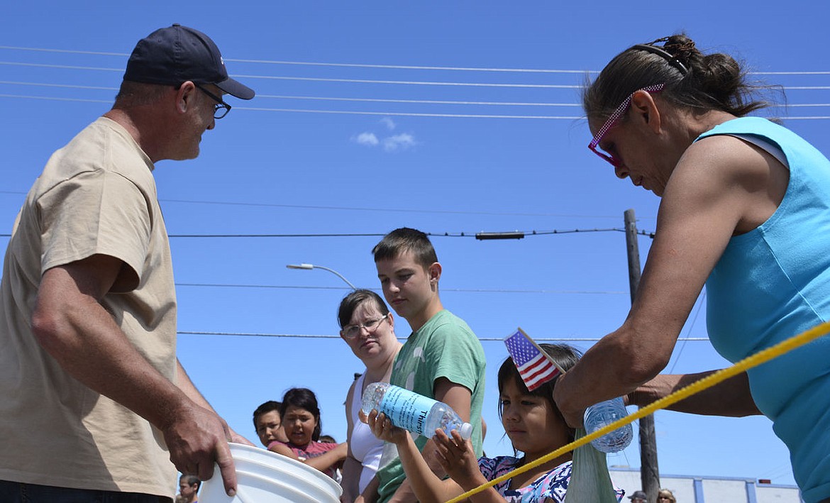 0707 loc LCL parade-watergiveaway.jpg