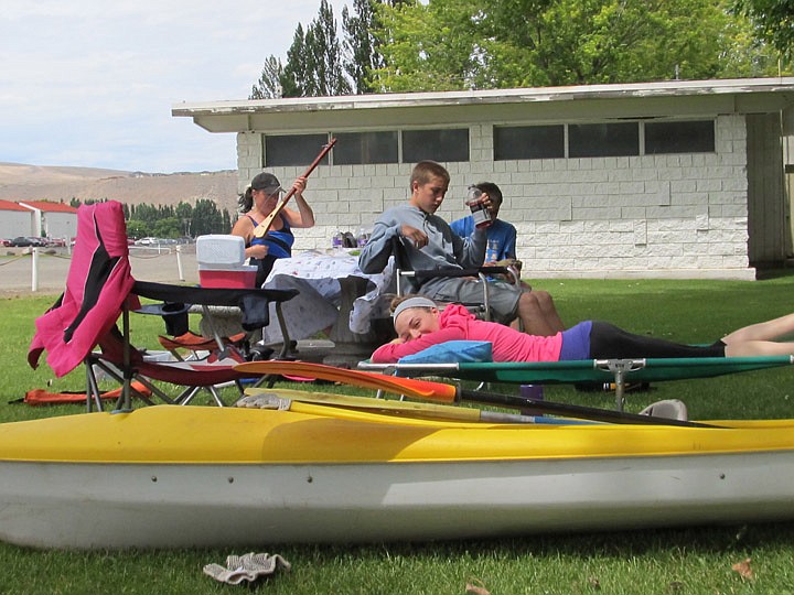 Leslie Tobin and three of her seven children picnic in the grassy area at the Crescent Bar public beach. They include daughter Jamie Woods, trying to sleep, and sons Philip and Douglas. They enjoy kayaking.