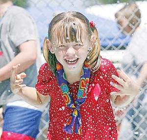 &lt;p&gt;Shelby Cole, 7, makes a quick trip through the splash pad at Roosevelt Park Saturday.&lt;/p&gt;