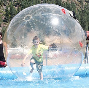 &lt;p&gt;Seven-year-old Tyler O'Rourke tests out the water ball feature during Troy's Old Fashion Fourth of July celebration at Roosevelt Park Saturday.&lt;/p&gt;