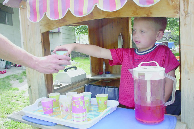 &lt;p&gt;Liam Lyman, 5, sells Gatorade outside his home during the county-wide yard sale event. According to his mom Shari, Liam had been keeping busy all day.&lt;/p&gt;