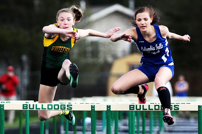 &lt;p&gt;Whitefish's Allie Schulz and Columbia Falls' Mary Baker clear the final hurdle in the 100-meter event at the ARM Invitational on Saturday, April 25, 2015. (Aaric Bryan/Daily Inter Lake)&lt;/p&gt;