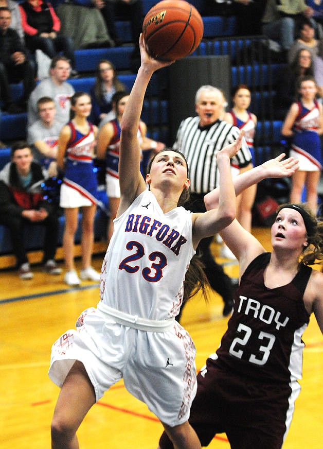 &lt;p&gt;Valkyrie Mattie McAnally drives past Trojan Allie Brown for a basket during the first half in Bigfork on Friday. (Aaric Bryan/Daily Inter Lake)&lt;/p&gt;