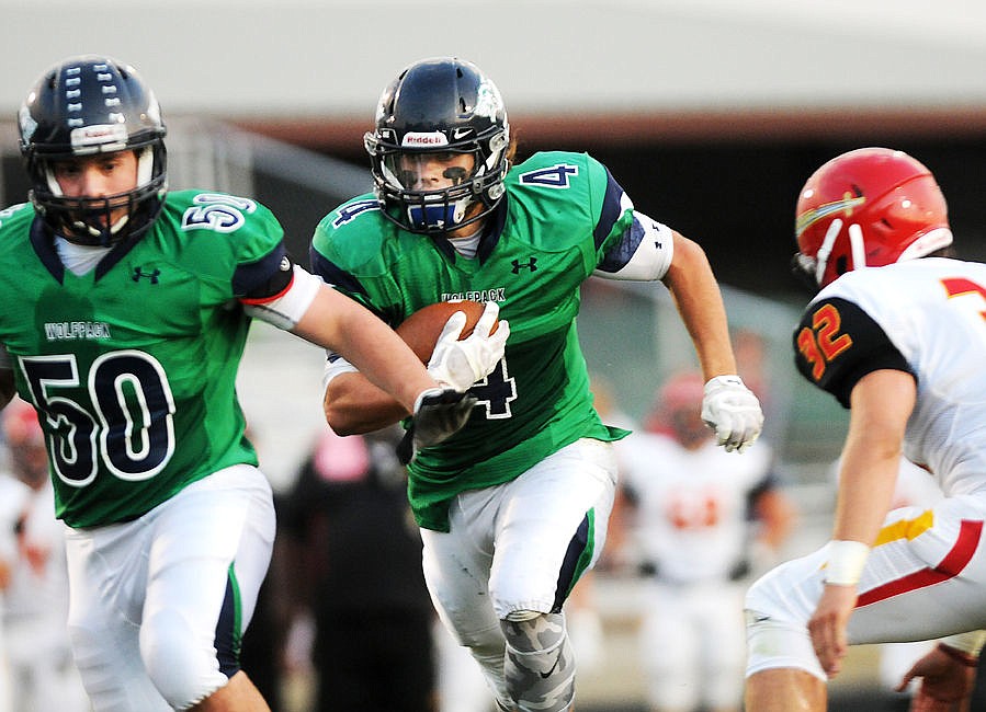 &lt;p&gt;Glacier running back Thomas Trefney follows the block of Adam Heastan during the Wolfpack's rout of Missoula Hellgate on Sept. 24, 2015. (Aaric Bryan/Daily Inter Lake)&lt;/p&gt;