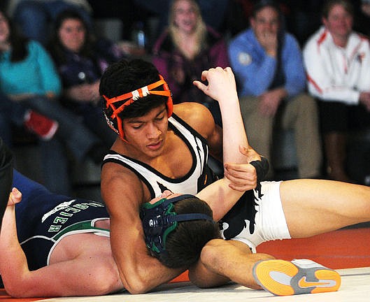 &lt;p&gt;Flathead's Trae Vasquez puts Glacier's Reuger Baier in a head and arm hold to pin him in the first period during the 132-bout at the crosstown dual at Flathead on Thursday. (Aaric Bryan/Daily Inter Lake)&lt;/p&gt;