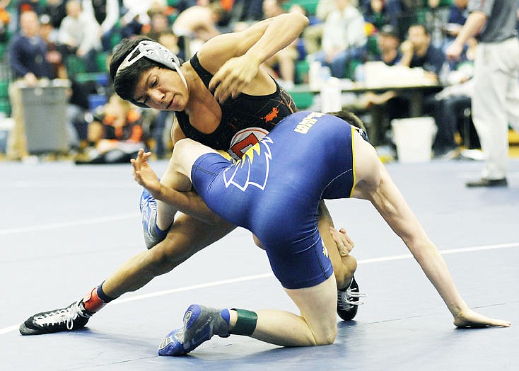 &lt;p&gt;Flathead's Trae Vasquez flips Big Sky's Demo Koures in the 113-pound championship match of the Western AA Divisional Seeding Tournament on February 7, 2015 at Glacier High School. Vasquez won the match 9-2. (Aaric Bryan/Daily Inter Lake)&lt;/p&gt;