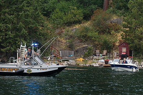 &lt;p&gt;Bayview residents leave their home as Kootenai County Sheriff&#146;s Office marine deputies patrol Lake Pend Oreille.&lt;/p&gt;