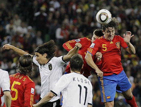 &lt;p&gt;Spain's Carles Puyol, right, heads the ball toward the net for the game-winning goal in a 1-0 win over Germany in the semifinals of the World Cup on Wednesday at Durban, South Africa.&lt;/p&gt;