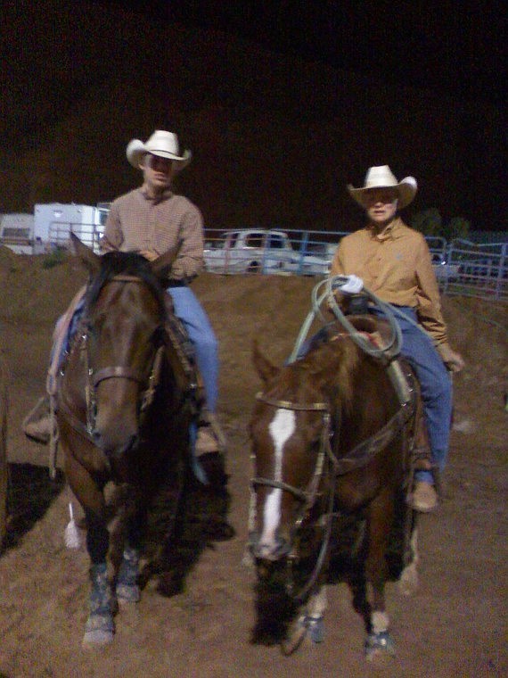 Wyatt Lytton and Will Powell take time between roping runs to pose for a photo during the Junior Rodeo Nationals last weekend in Gallup, N.M.