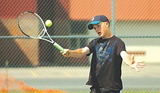 Brady Hislop gets his bracket in the right position during the Mission Valley Open tennis tournament last weekend in Polson.