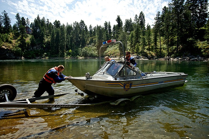 &lt;p&gt;JEROME A. POLLOS/Press Kootenai County Sheriff Department dive team members load a boat onto a trailer after taking part in a rescue effort on the Spokane River near Corbin Park.&lt;/p&gt;