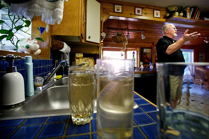 &lt;p&gt;JEROME A. POLLOS/Press Joe Chisum describes the amount of work he'll have to undertake in order to clear the heavily sedimented water from the water lines, hot water heater and ice maker after work done Thursday by the City of Coeur d'Alene on Harrison Avenue caused the dirty water.&lt;/p&gt;