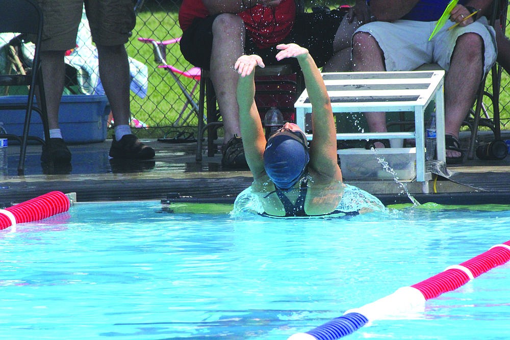 &lt;p&gt;Danika Whitcomb pushes off the wall during the 100-meter backstroke competition at last weekend's swim meet.&lt;/p&gt;