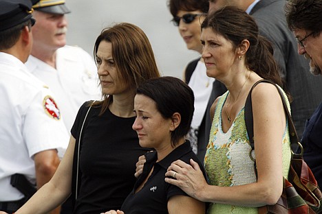 &lt;p&gt;Two Hungarian teachers, center and center left, who survived a duck boat crash on Wednesday, are consoled by a U.S. woman, right, who served as a host for a Hungarian student group, as they view the site where two of their students went missing on Thursday. An amphibious sightseeing boat that stalled in the Delaware River was knocked over by an oncoming barge Wednesday, spilling 37 people overboard and leaving two passengers unaccounted for after a frantic rescue effort.&lt;/p&gt;