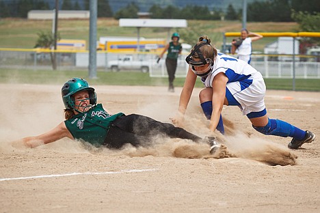 &lt;p&gt;Coeur d'Alene Crush 98's Miranda Amos records the out as Kourtney Dawson of the Idaho Sliders slides into third base Friday during the state ASA 12 and under tournament at Ramsey Park in Coeur d'Alene.&lt;/p&gt;