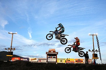 <p>Local riders of all ages whip up dirt and soar through the air at the Coeur d'Alene Arenacross event Friday, July 8, 2016 at the Kootenai County Fairgrounds. Members of the Metal Mulisha do backflips and other stunts over a 70 foot gap at intermission, followed by more dirtbike racing under the stadium lights. To purchase photo, please visit www.cdapress.com/photo</p>