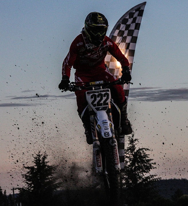<p>Local riders of all ages whip up dirt and soar through the air at the Coeur d'Alene Arenacross event Friday, July 8, 2016 at the Kootenai County Fairgrounds. Members of the Metal Mulisha do backflips and other stunts over a 70 foot gap at intermission, followed by more dirtbike racing under the stadium lights. To purchase photo, please visit www.cdapress.com/photo</p>