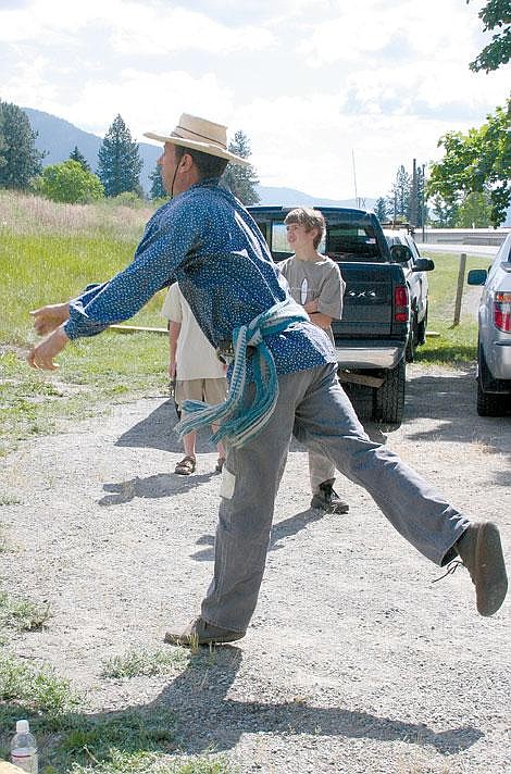 Jamie Doran/Valley Press Charlie Patalon, from Maryville, Calif., demonstrates the proper way to throw a tomahawk to onlookers.