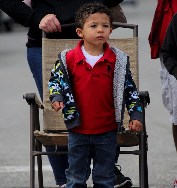<p>KATIE HARTWIG/Press Jeremiah Cade, 4, watches the parade on Saturday.</p>