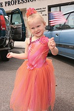 Three-year-old Kaycee Wright celebrated America's birthday pretty in pink in the Polson Fourth of July parade Sunday.
