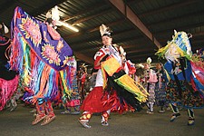 Sierra Lena Snow Webster Shorty, from Pablo, dances to the beat of the drum during the grand entry Saturday at the Arlee Powwow.