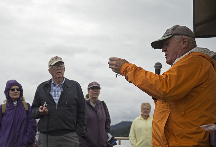 &lt;p&gt;LOREN BENOIT/Press Wildlife biologist Wayne Melquist, right, holds a fishing line he found in the nest with the three youngsters in it Saturday, which can be deadly to osprey, as well as other wildlife.&lt;/p&gt;