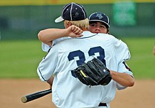 Josh Rustad of the Mission Valley Mariners gets a hug from Derrick Rathe during the Firecracker Tournament last weekend in Polson.