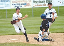 Mission Valley Mariners' shortstop Justin Evertz turns the double play against the Libby Loggers during his team's run to the tournament championship last weekend in Polson.