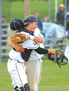 Tim Rausch of the Mission Valley Mariners gets a hug from Xavier Morigeau during the Firecracker Tournament last weekend in Polson.