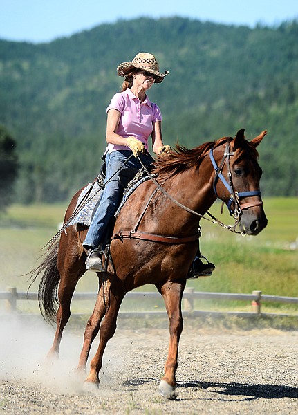 <p>Horseback Riding in Herron Jeannie Penner of Kalispell takes a lesson from Lorrye Hellem as she works with her Tennessee Walker Jehovah Jireh on Wednesday morning at Herron Park. (Brenda Ahearn/Daily Inter Lake)</p>